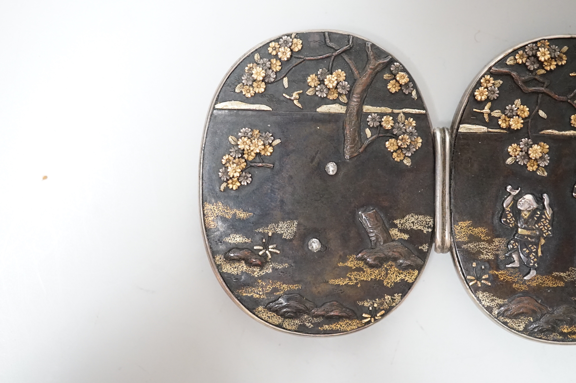 A Japanese Meiji period mixed metal belt buckle